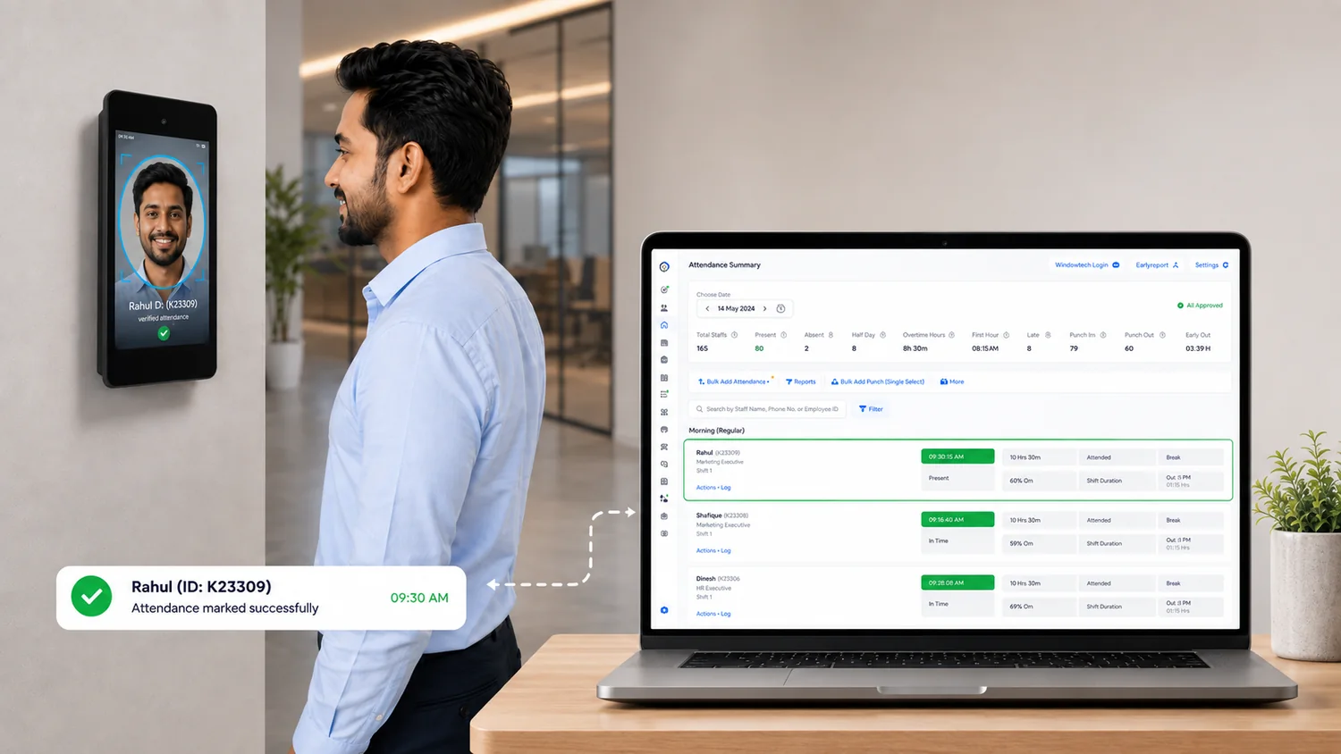 A worker looking at a Lens unit mounted by the door, his attendance confirmed on its screen, and on a laptop beside it the attendance summary already listing him as present at 09:30 with his hours running